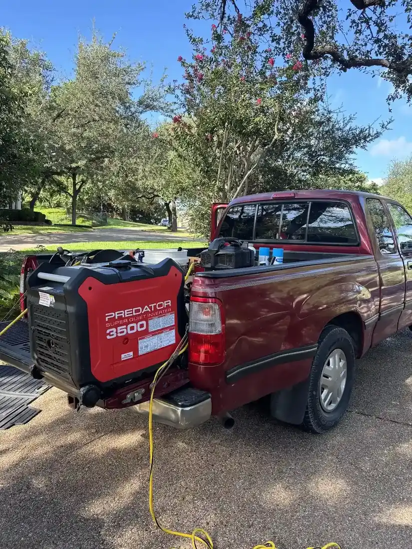 Mobile detailing setup with generator and equipment in a truck bed